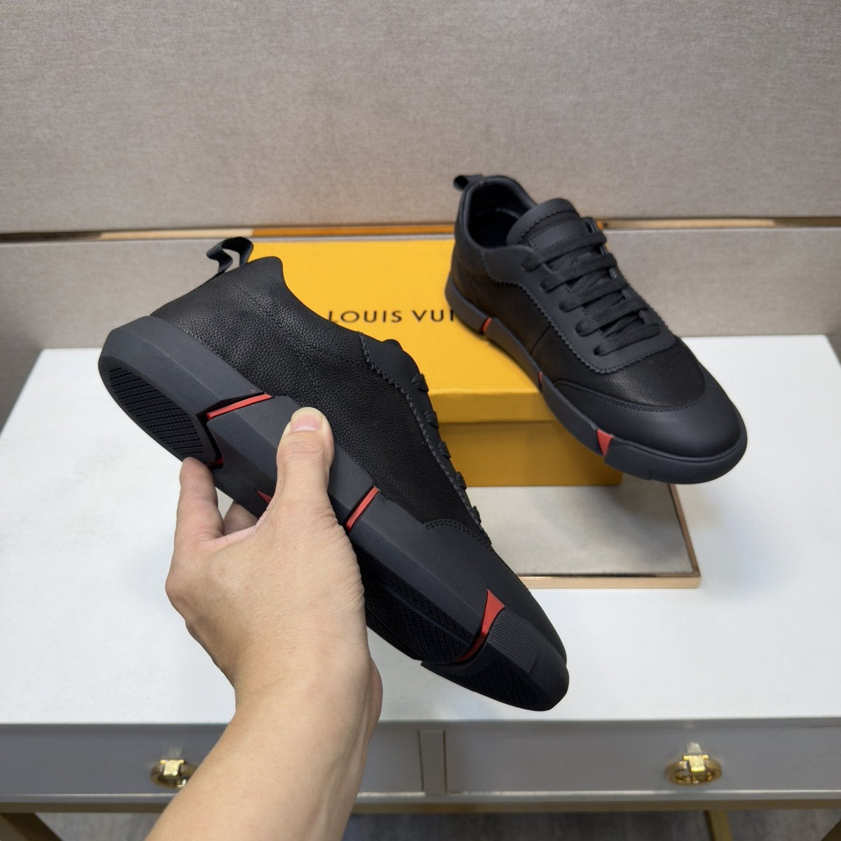 Louis Vuitton Black Low-Top Sneakers with Red Accents — model