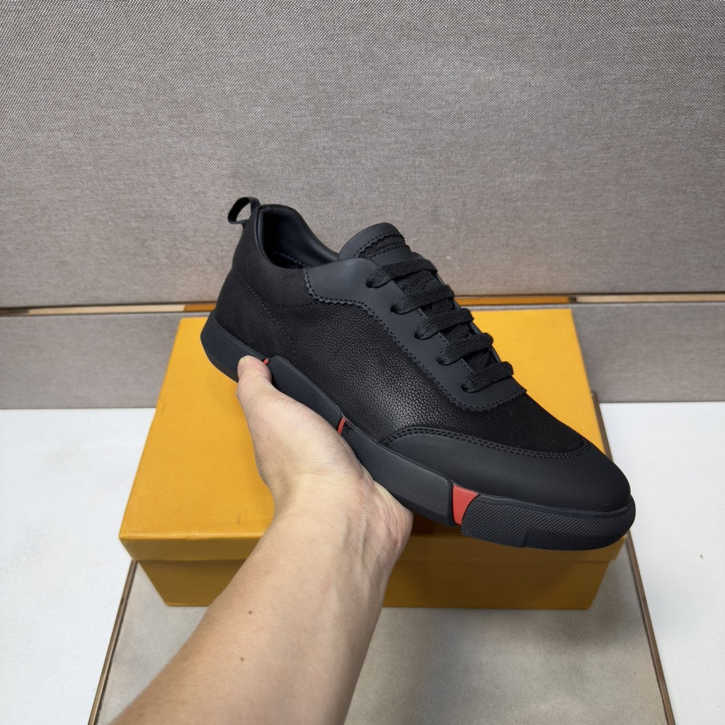Louis Vuitton Black Low-Top Sneakers with Red Accents — model
