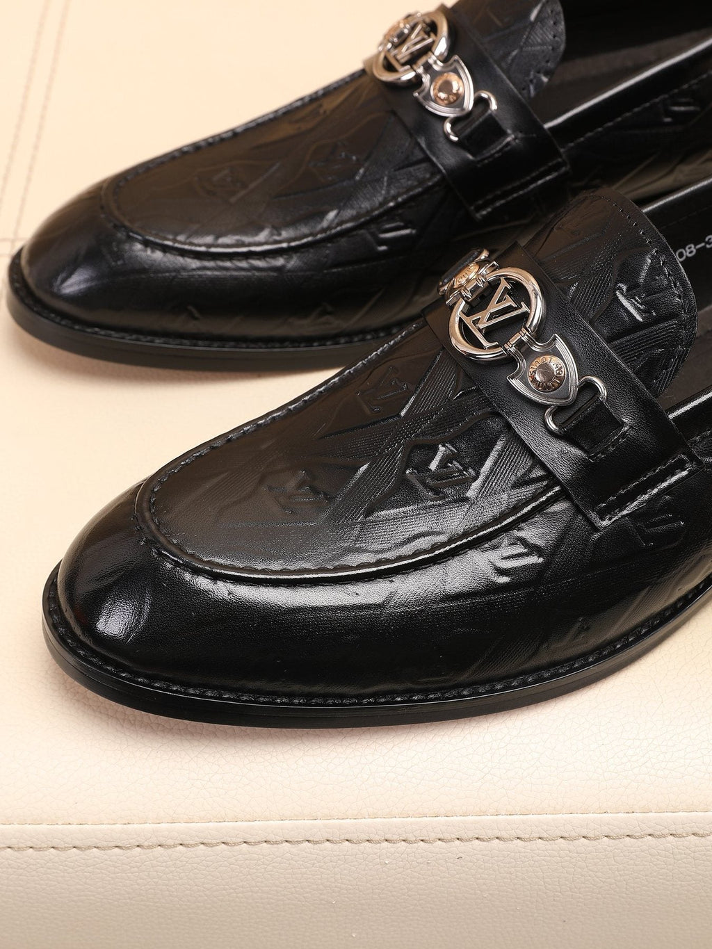 Louis Vuitton Black Embossed Loafers — detail