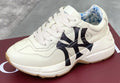 Gucci Cream Chunky Sneakers with Black Accents — hero