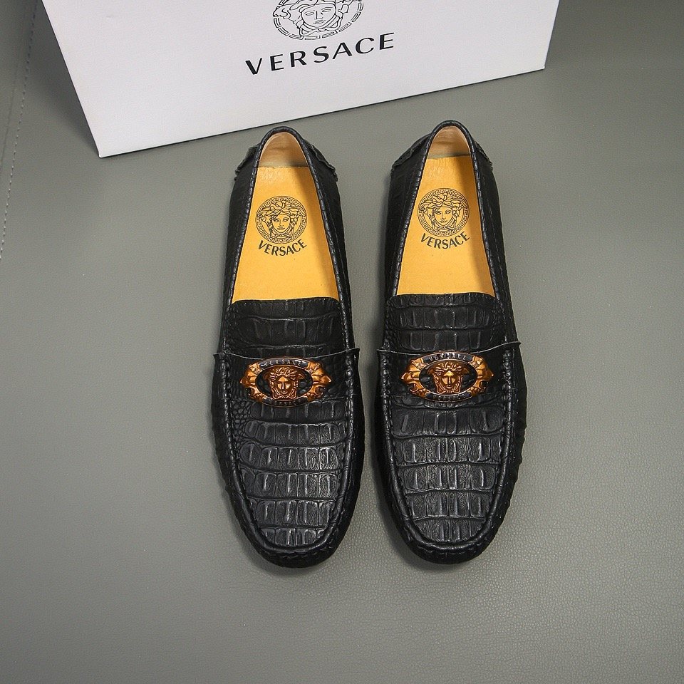 Men's Black Textured Loafers with Gold-Tone Ornament — front