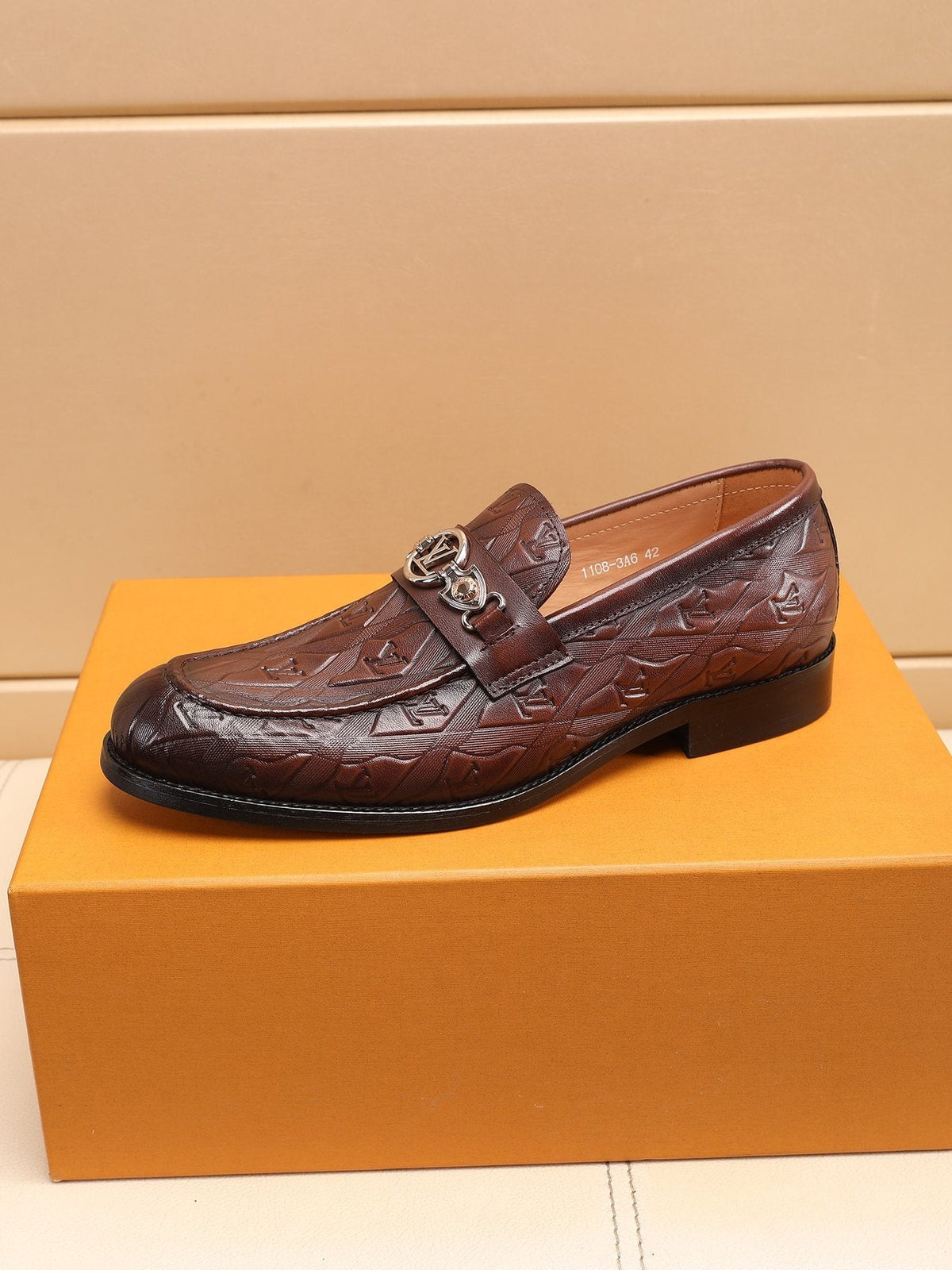 Louis Vuitton Dark Brown Embossed Loafers — side
