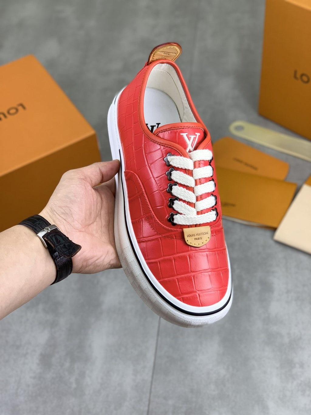 Louis Vuitton Red Embossed Low-Top Sneakers — model