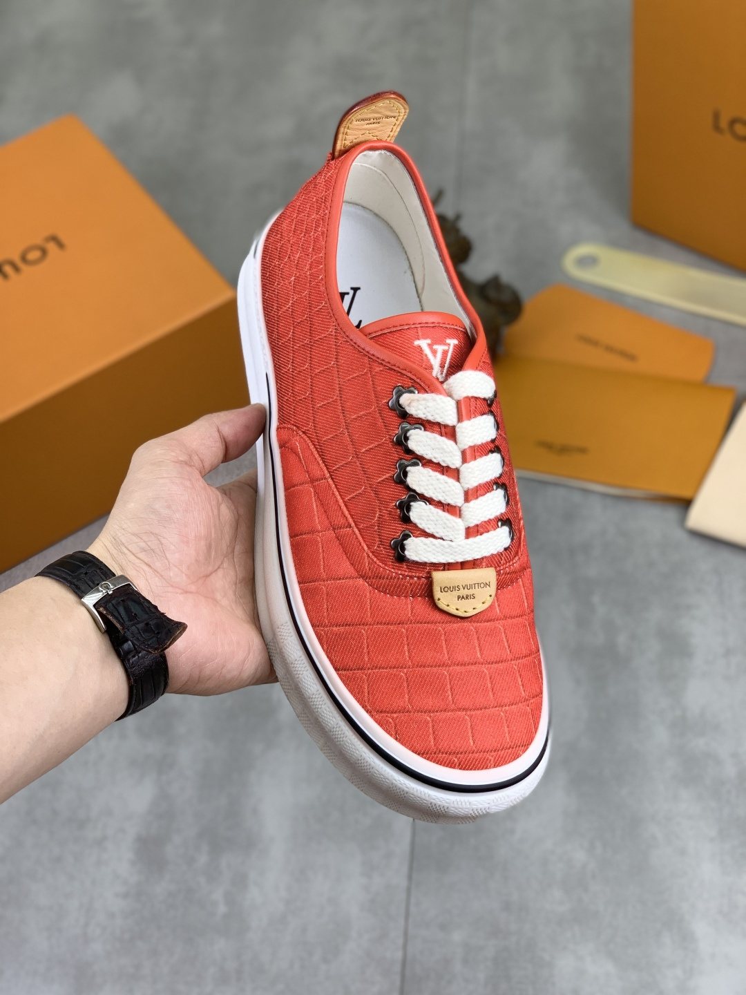 Louis Vuitton Coral Red Textured Low-Top Sneakers — model