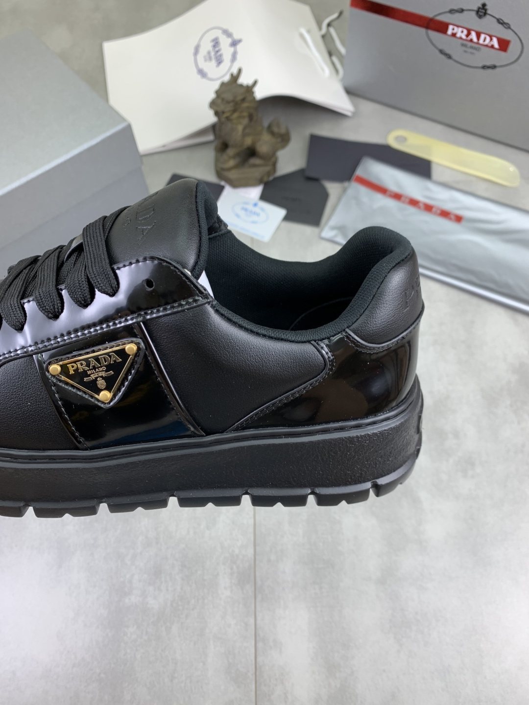 Prada Paneled Lug-Sole Low-Top Sneakers — detail