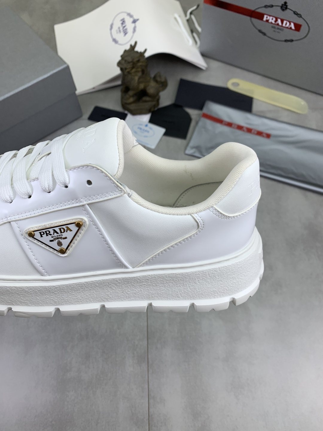 Prada Paneled Lug-Sole Low-Top Sneakers — detail