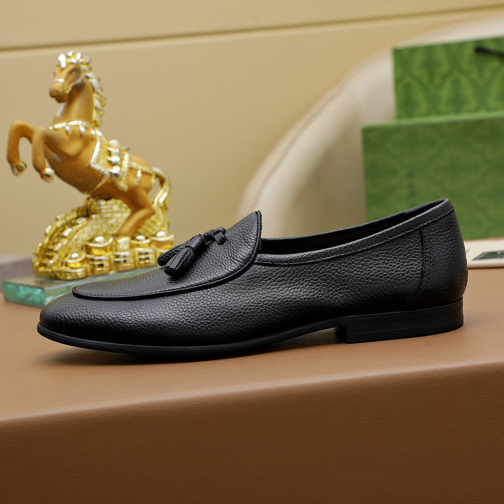 Gucci Textured Tassel Loafers — side