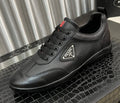 Prada Black Lace-Up Sneakers with Red Tab — hero