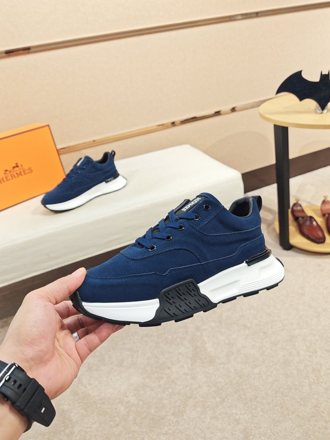Hermès Lace-Up Sculpted-Sole Sneakers — model