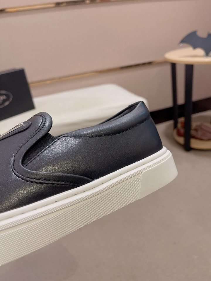 Prada Triangle-Patch Slip-On Shoes — detail