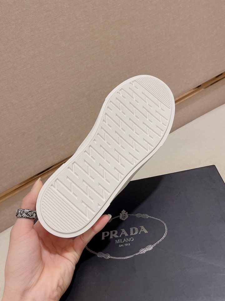 Prada Triangle-Patch Slip-On Shoes — detail