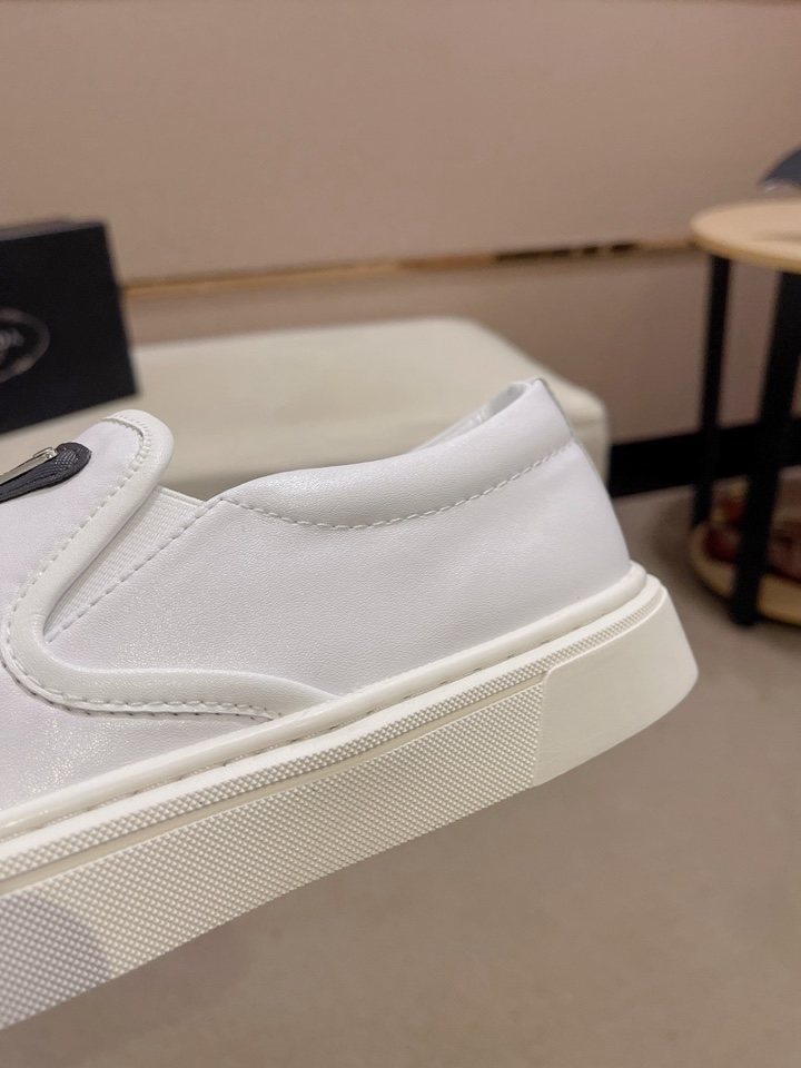Prada Triangle-Patch Slip-On Shoes — detail
