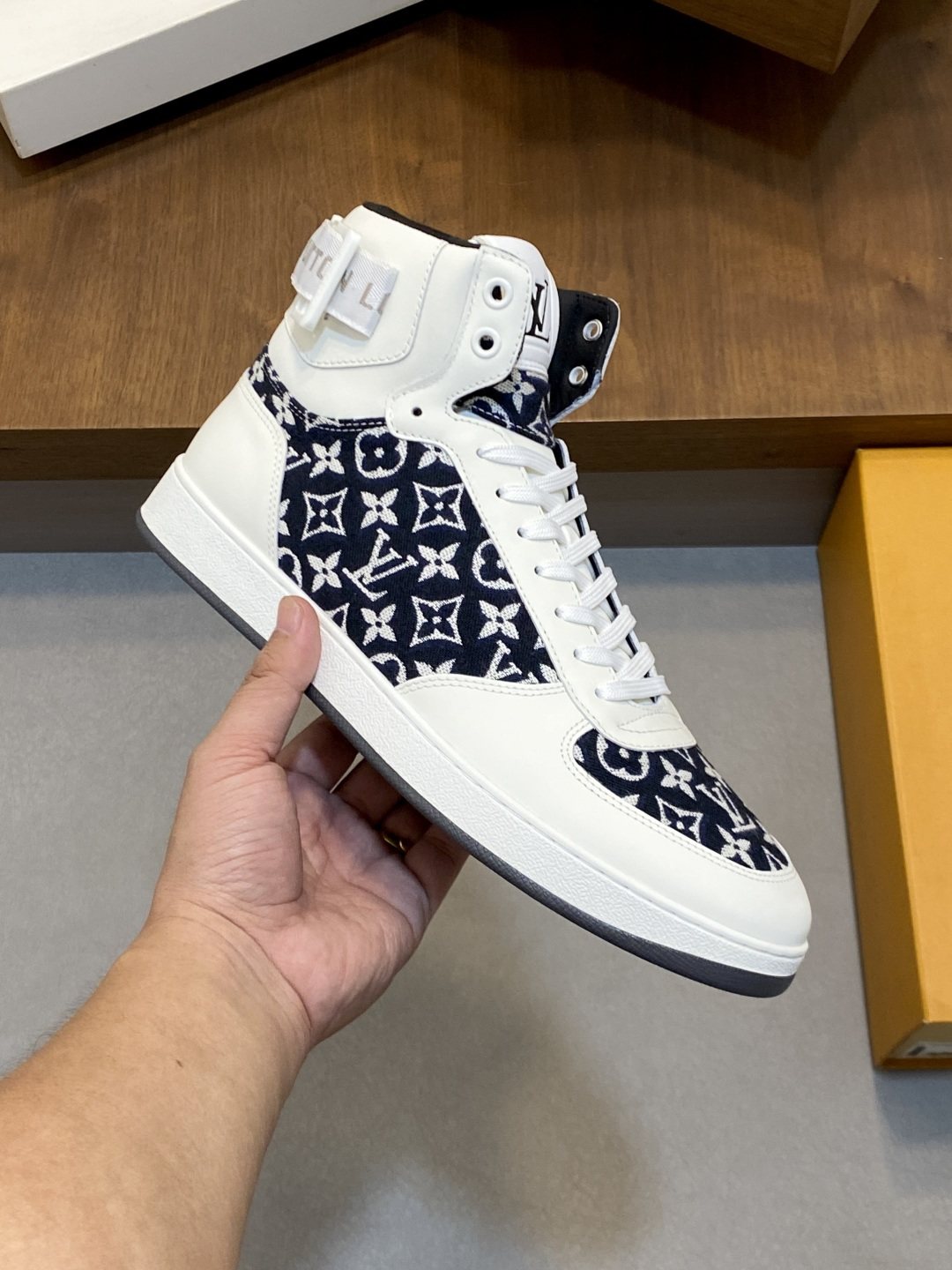 Louis Vuitton Rivoli Patterned High-Top Sneakers — model