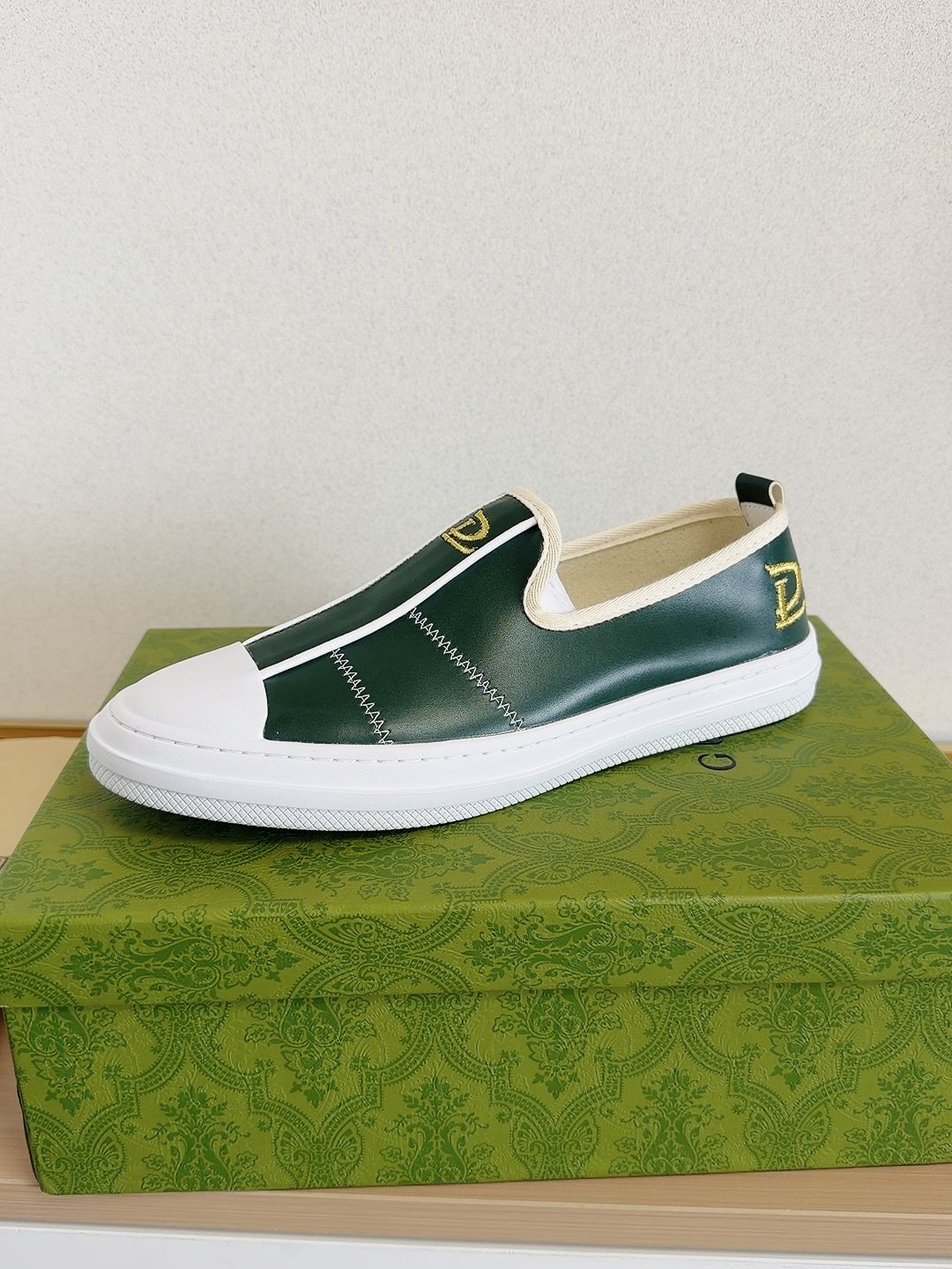 Gucci Brown Slip-On Sneakers with White Toe Caps — side