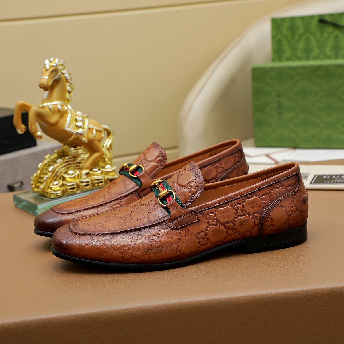 Gucci Patterned Metal-Bit Loafers — hero