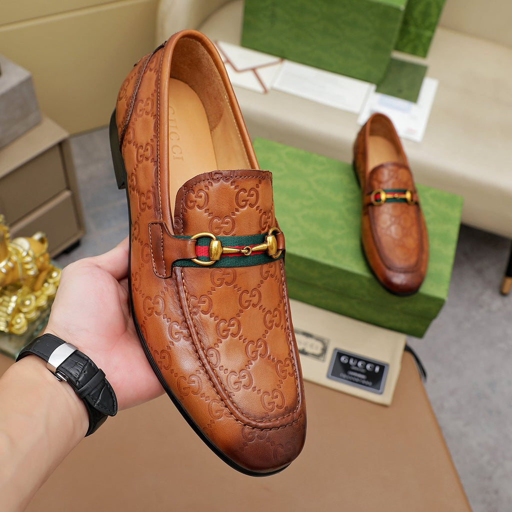Gucci Patterned Metal-Bit Loafers — model