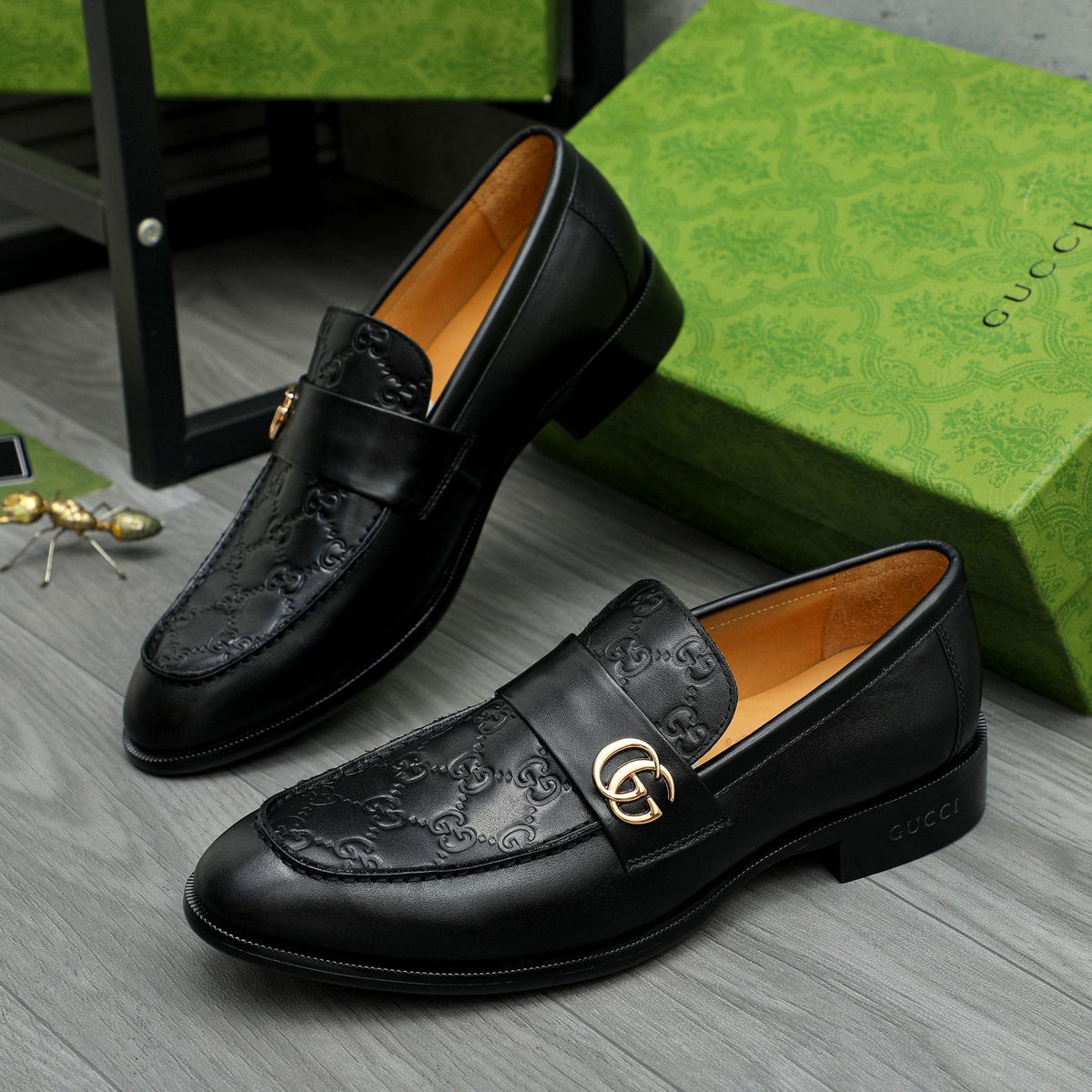 Gucci Black Embossed Loafers with Gold-Tone Detail — front