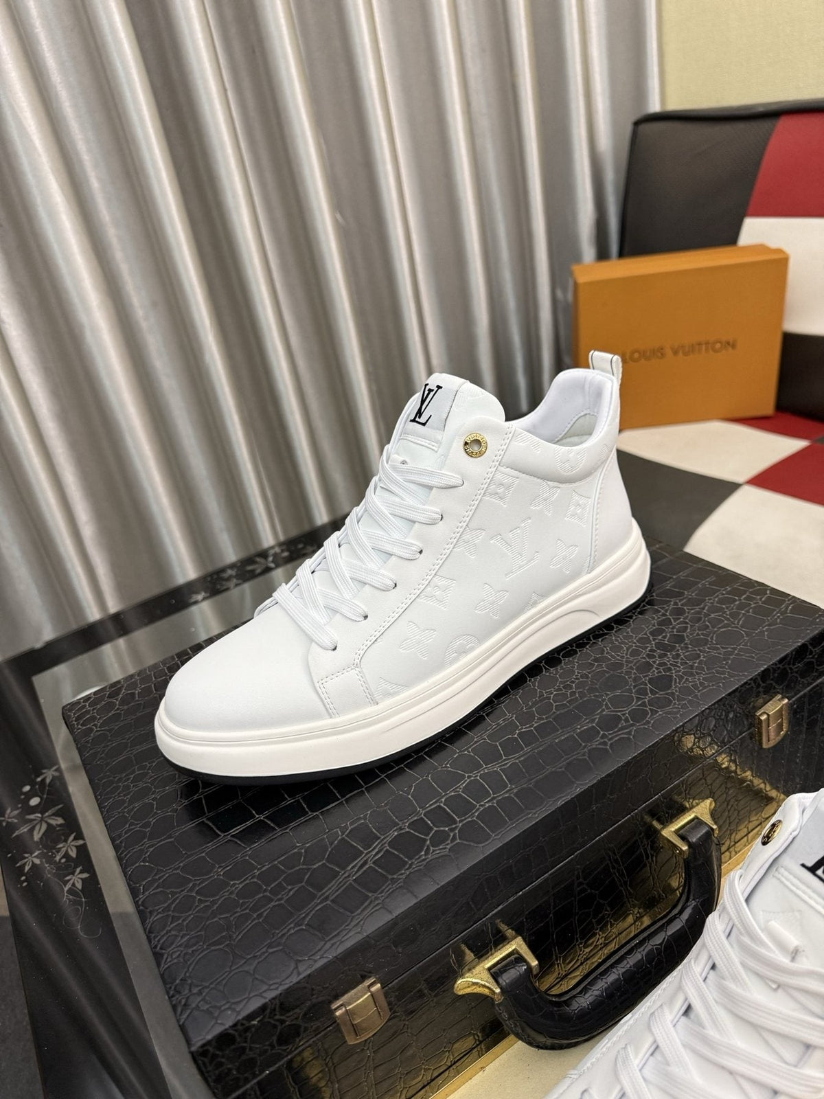 Louis Vuitton Embossed High-Top Sneakers — front