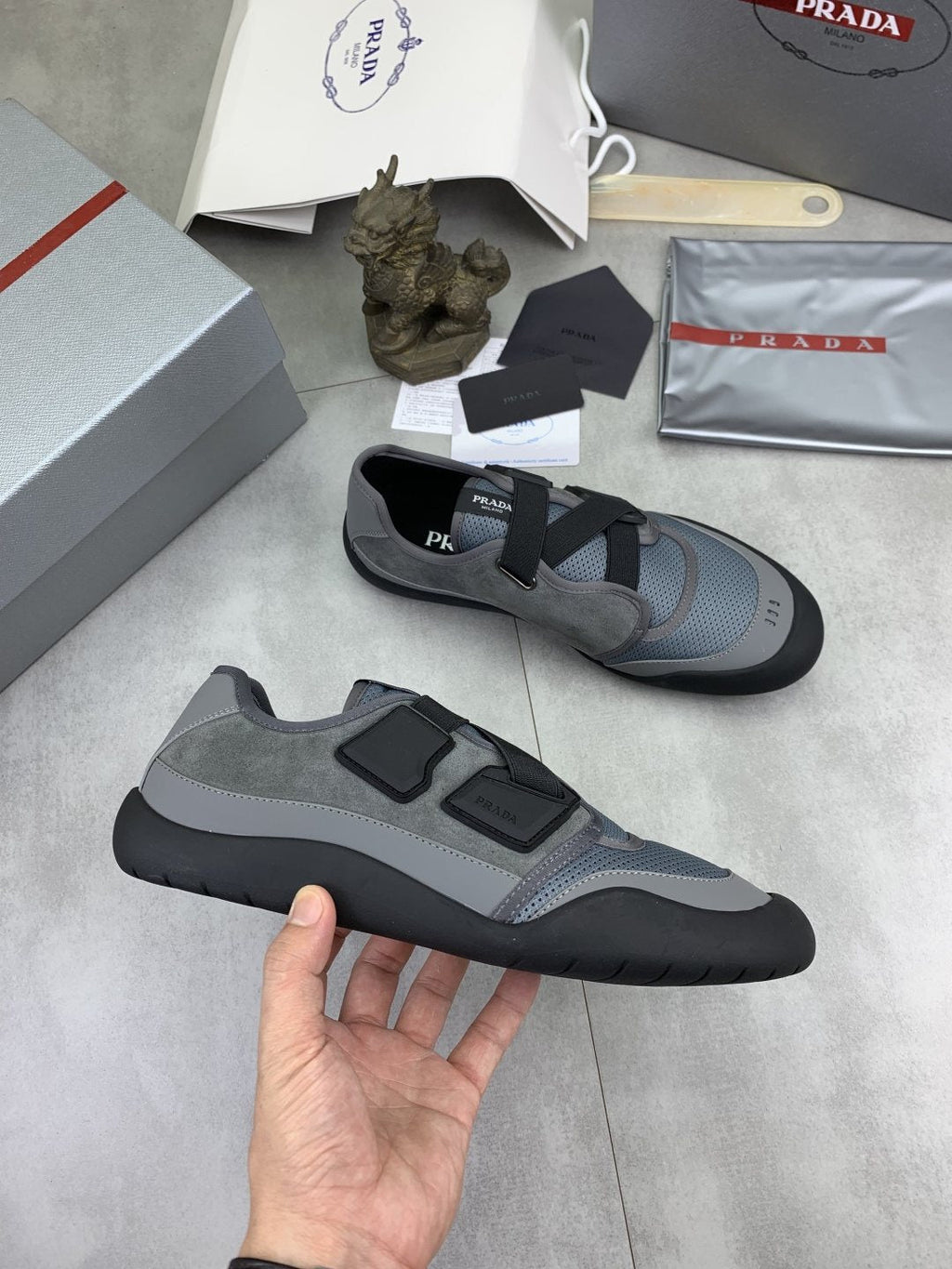 Prada Cross-Strap Low-Top Sneakers — model