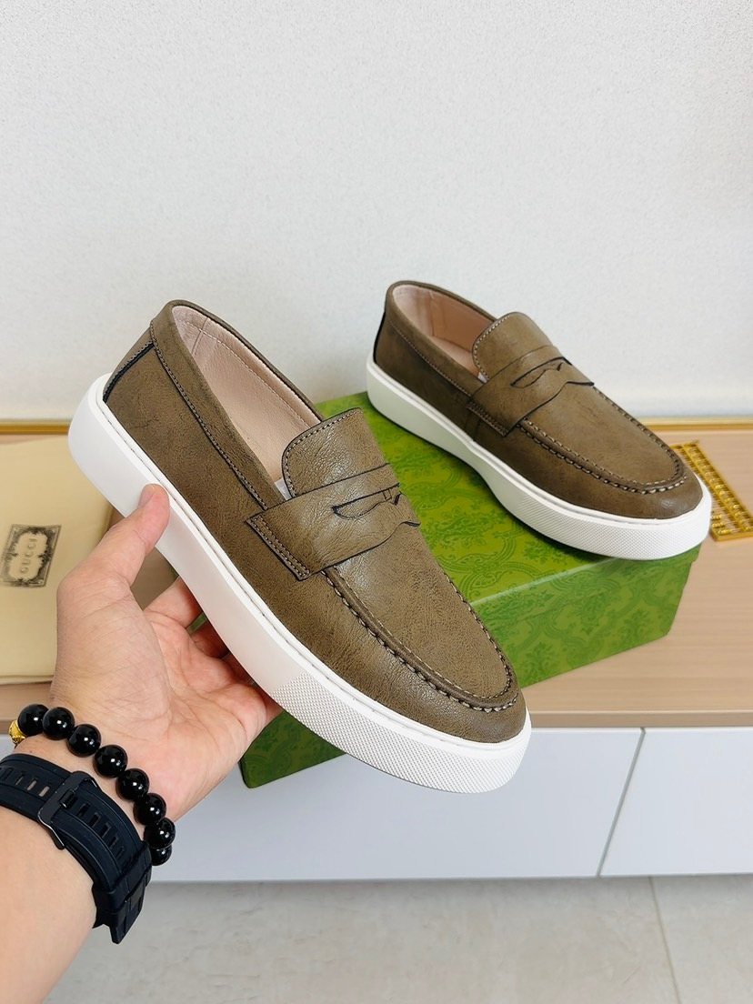 Gucci White-Sole Penny Loafers — model