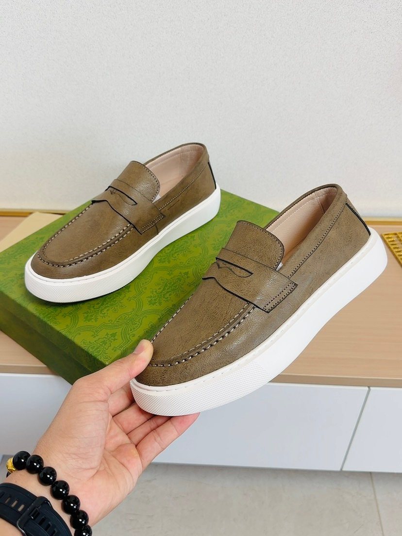 Gucci White-Sole Penny Loafers — model