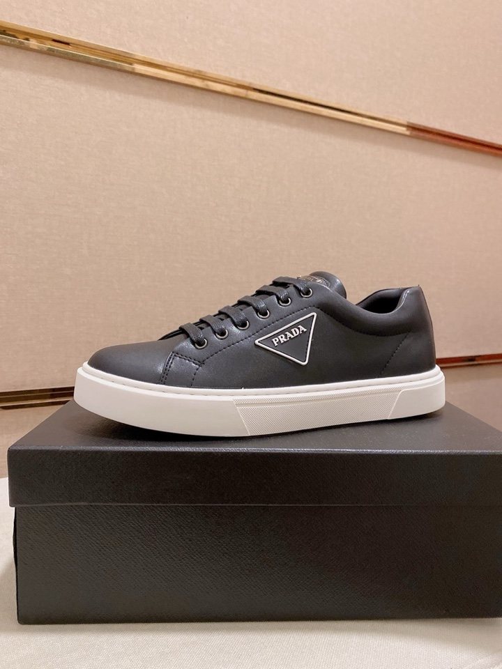 Prada Plaque Low-Top Sneakers — hero