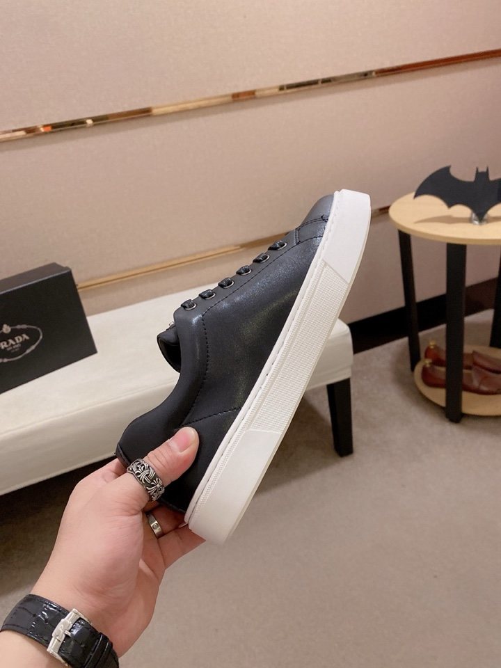 Prada Plaque Low-Top Sneakers — model
